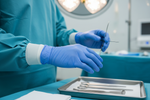 Load image into Gallery viewer, doctor's hands with medical grade gloves blue

